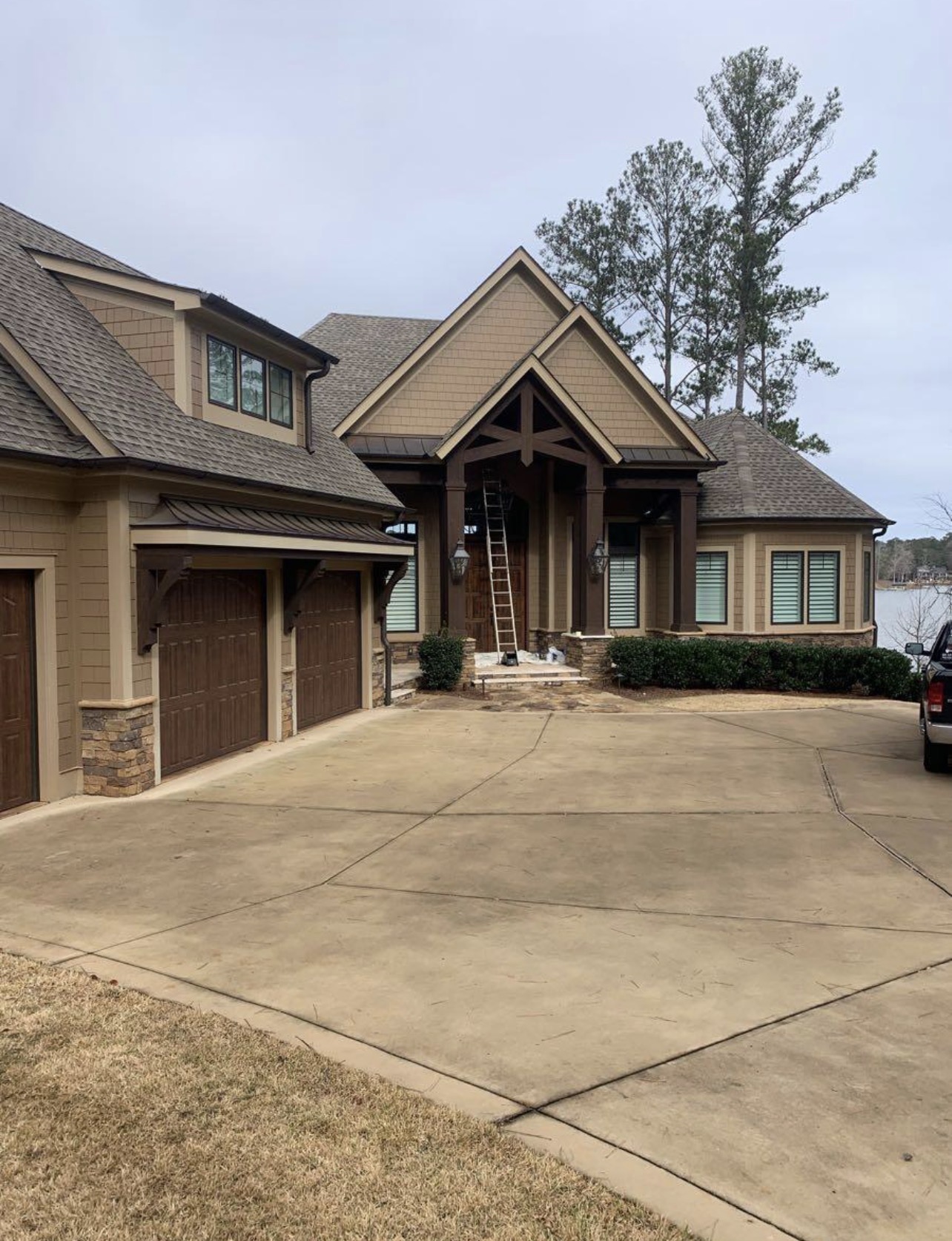 Exterior repaint of a lakefront home by Lumsden Enterprise